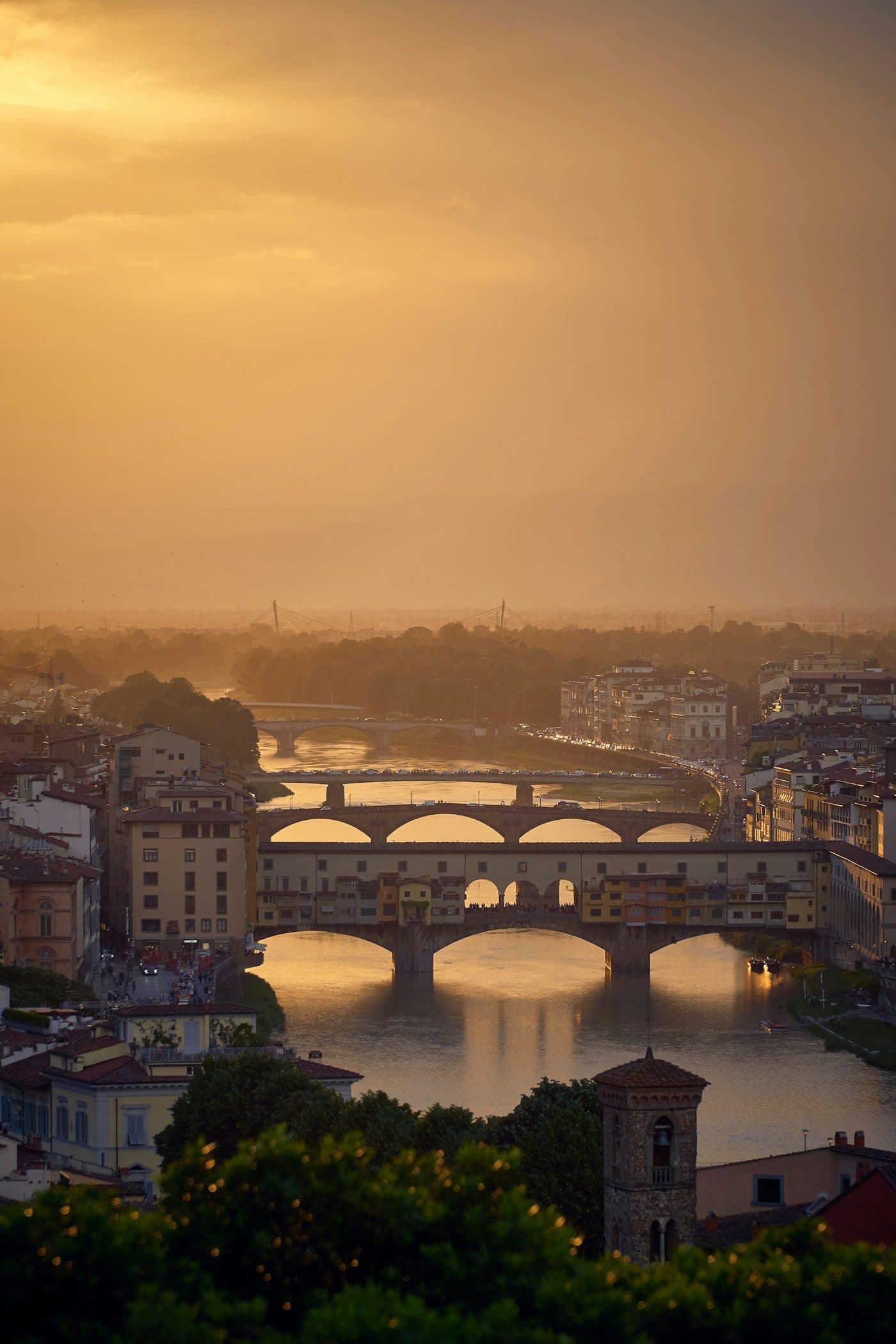 The bridges of Florence over the Arno at golden hour