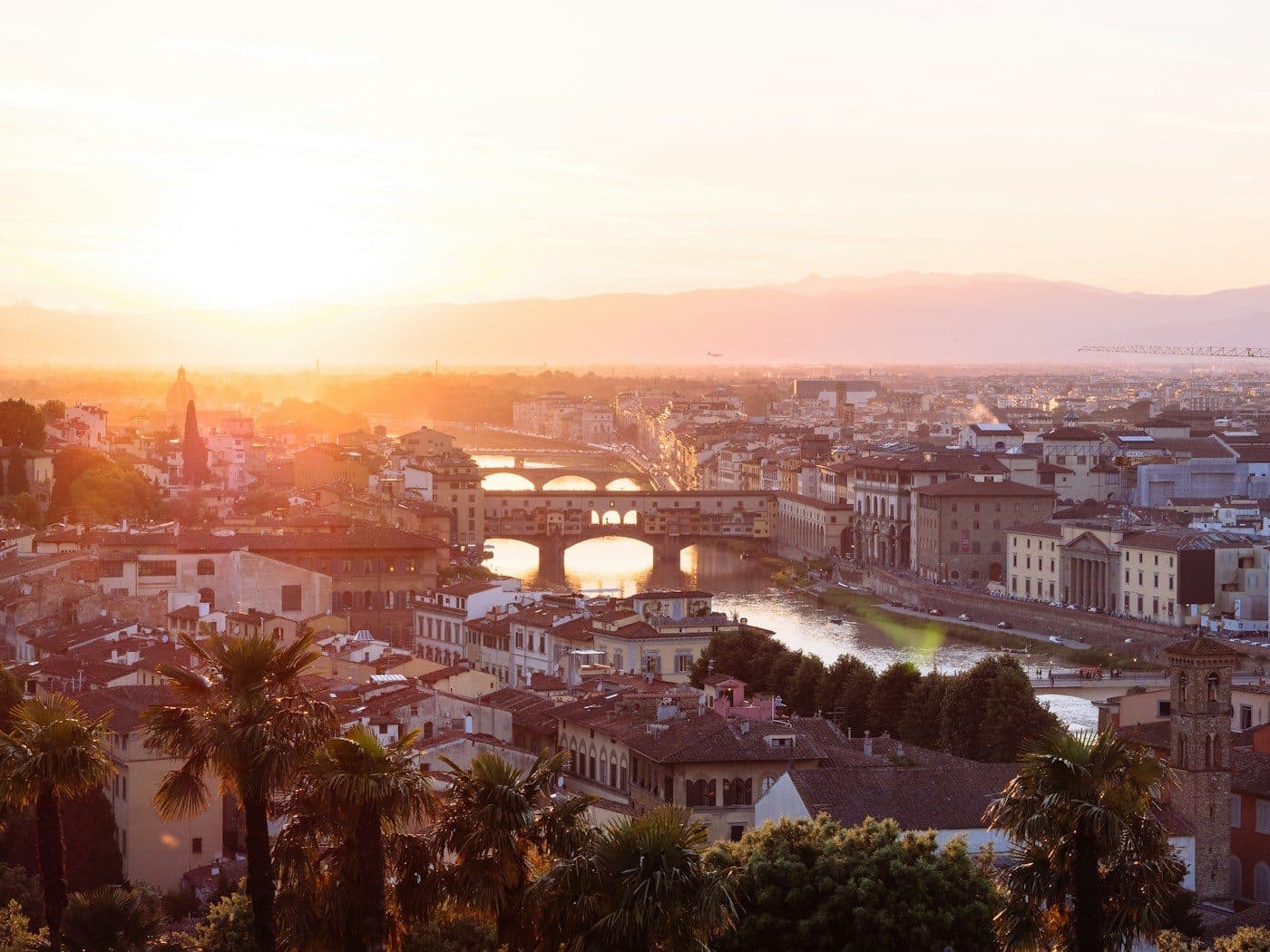 Aerial view over the terracotta rooftops of Florence at sunset
