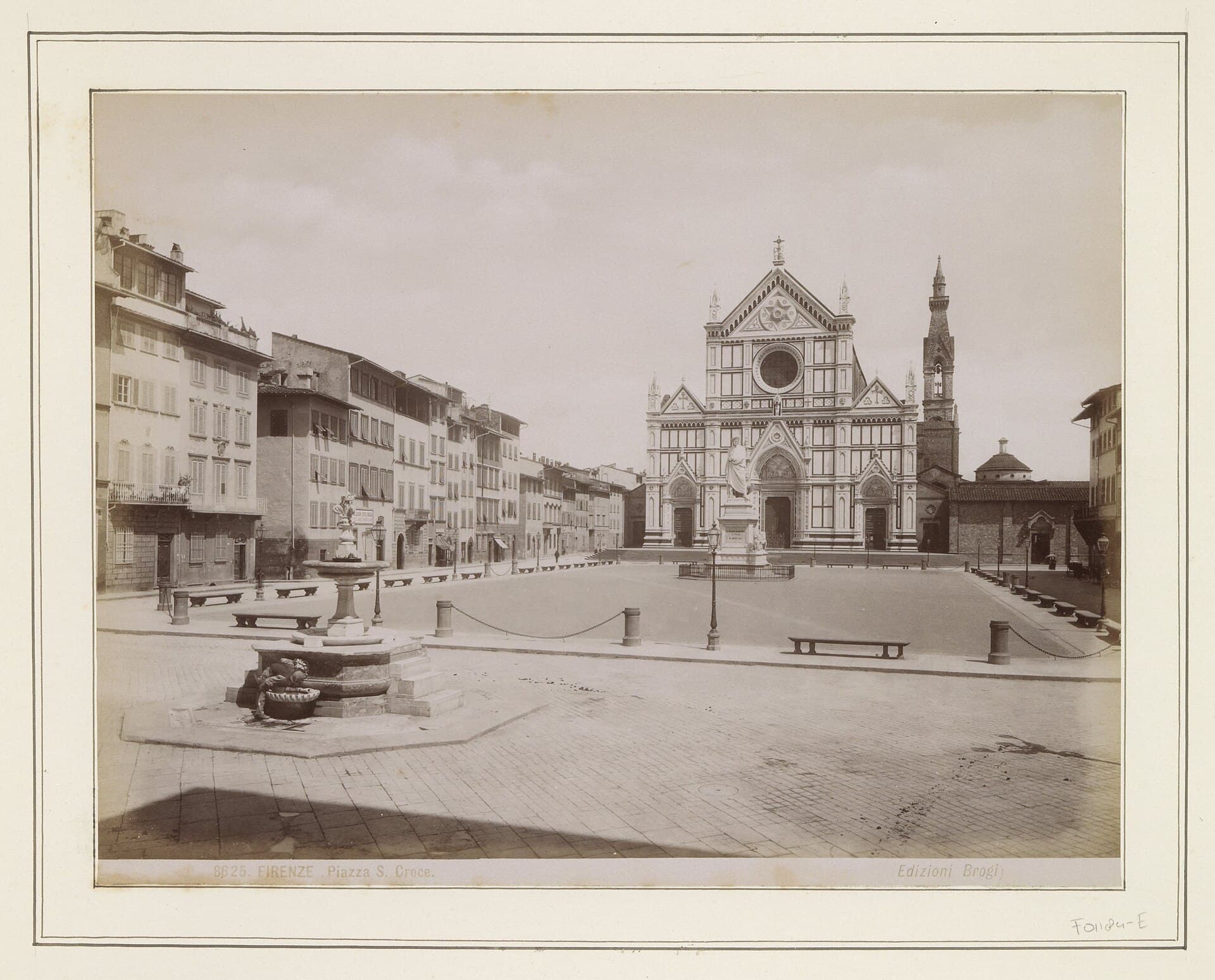 A nineteenth century photographic print of Piazza Santa Croce in Florence, empty, with the basilica facade, the bell tower and the statue of Dante